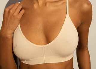 What are the key factors in achieving natural-looking breast augmentation results